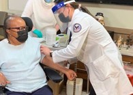 Veteran receiving a COVID-19 vaccine