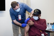 Patient Advocate, Carlo Dixon, receives the COVID-19 vaccine