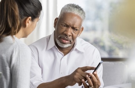 A Veteran reviewing information about dementia with his doctor 