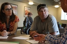 A Veteran talking to his health care team