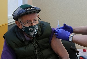 A Veteran receiving his COVID-19 vaccine