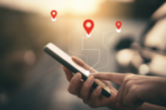 person touching phone screen displaying location icons