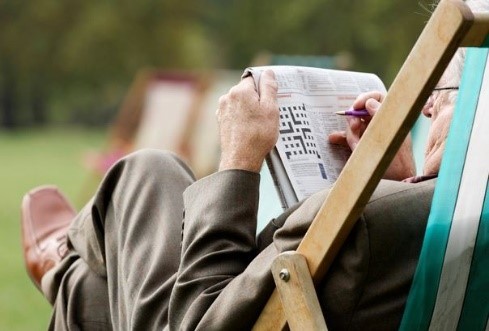 A Veterans completing a crossword puzzle