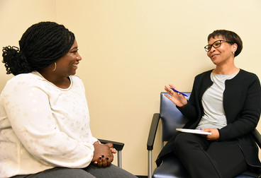 A Veteran talking to her counselor 