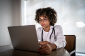 Female medical staff at laptop