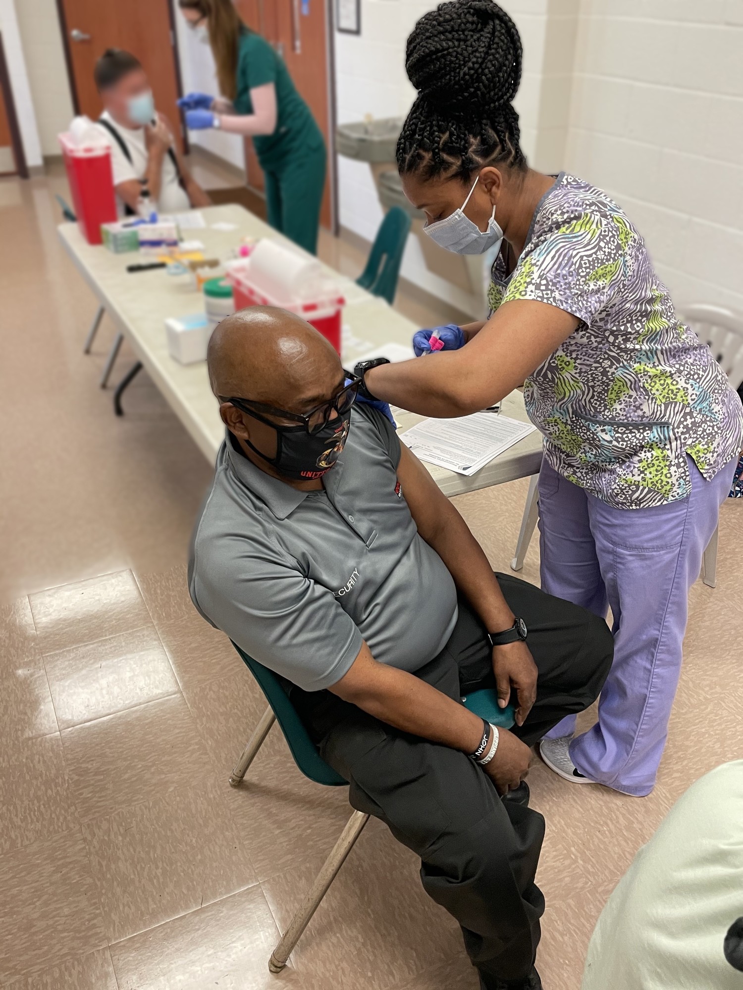 Hill receiving vaccine