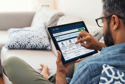 A man using a tablet to access My HealtheVet