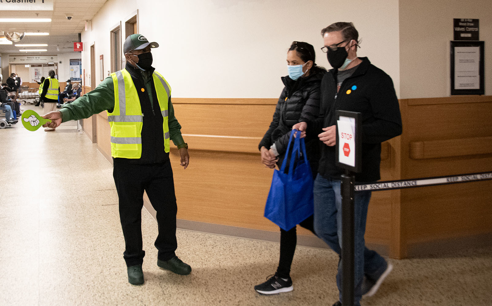 Veteran and family member being directed for their vaccine