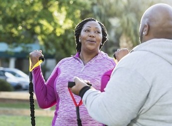 A Veteran exercising with resistance bands 