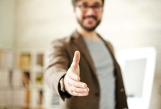 Image of man extending hand to shake