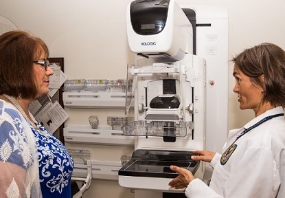A Veteran talking to her doctor about what to expect during her mammogram 