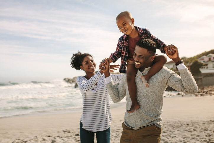 A family walks on the beach