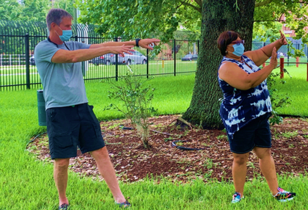 Two people doing a standing exercise