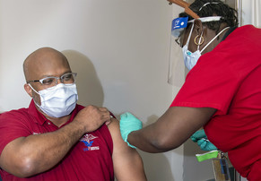 A man gets a COVID-19 vaccine 