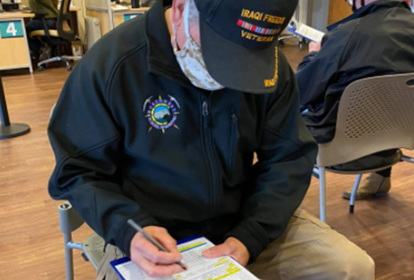 A Veteran receiving information about debt relief 