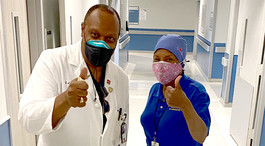 Two nurses giving the thumbs up