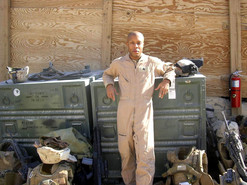 Veteran standing with shipping crates