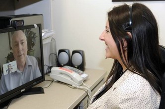 A Veteran using VA Video Connect to talk to their doctor