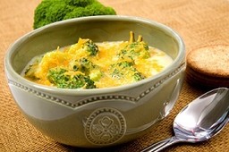A bowl of broccoli and cheddar soup