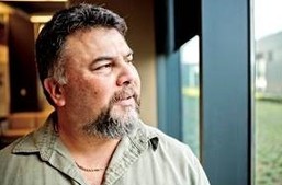 A Veteran thinking while looking at the window