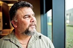 A Veteran thinking while looking at the window