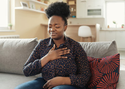 A Veteran having pain in her chest