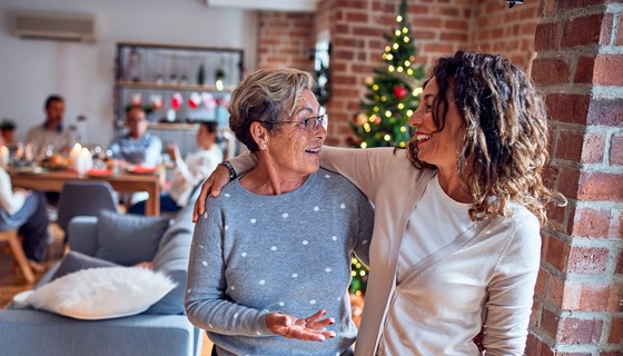 two women talking Christmas setting