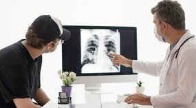 Doctor and patient looking at lung x-ray