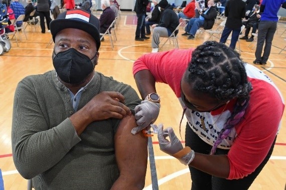 A Veteran receiving a COVID-19 vaccine 