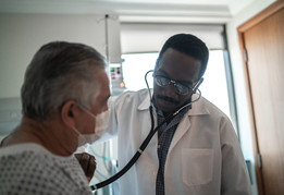 A VA health care provider is listening to a Veterans’ heart 