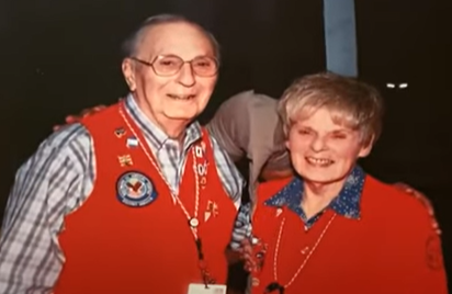 Jeannette Feldman and husband Edward Feldman in VA volunteer red vest