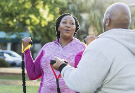A Veteran safely working out with a friend