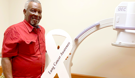 Veteran holding Lung Cancer Awareness ribbon