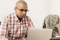 A Veteran using their laptop