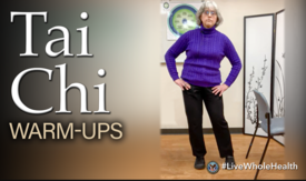 A woman standing in tai chi posture
