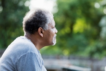 A Veteran relaxing outdoors to manage his anxiety 