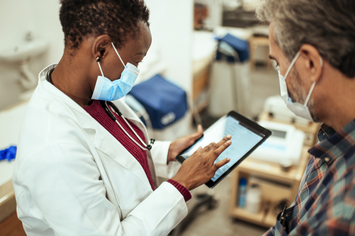 A Veteran sharing his health history with his doctor