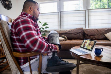 A Veteran on a Video Connect call with their doctor and caregiver