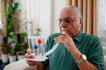 A Veteran testing his breathing capacity