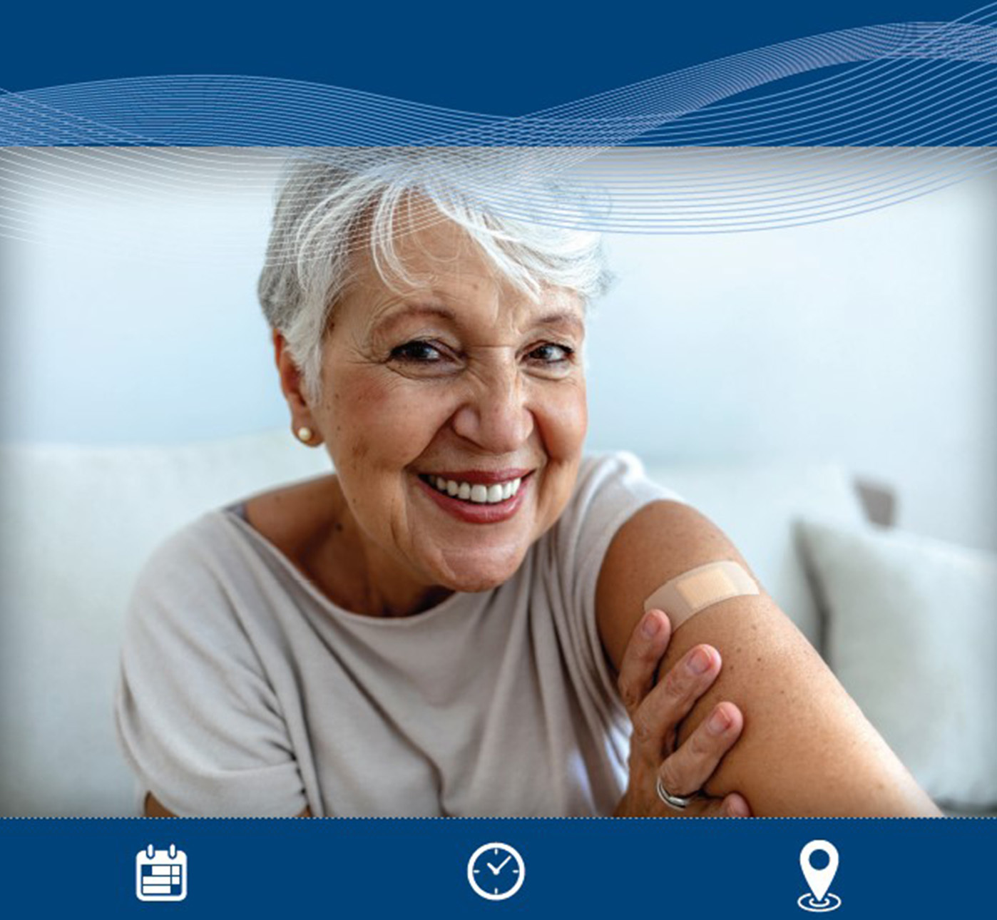 A woman shows off an adhesive bandage on her shoulder