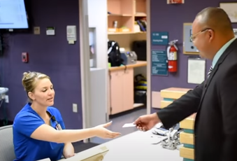 Woman grabbing card from man