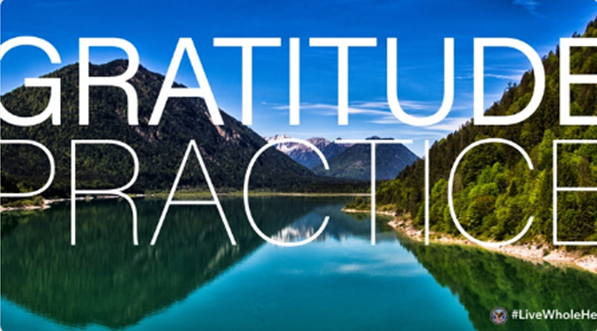 A lake with the words "practice gratitude" superimposed over it
