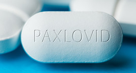 Close up photo of Paxlovid pill.