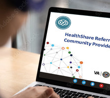 Laptop with HRSM site shown.