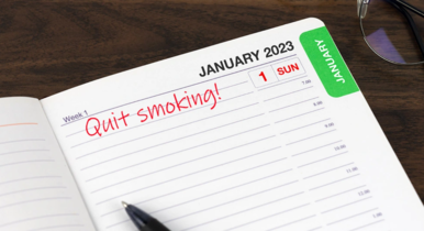 A desk diary with the words "quit smoking" written next to the date of January 1