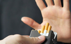 Quit Smoking, hand up to offer of cigarettes.
