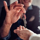 Landlord handing keys to tenant