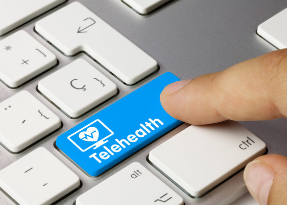 Photo of keyboard with a "Telehealth" button, to convey that telehealth is as simple as pushing a button.
