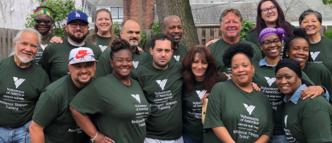 A group of people wearing tee shirts with the Volunteers of America logo