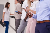 People look at their cell phone